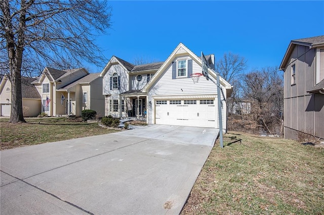 traditional home with a front lawn, concrete driveway, and a garage