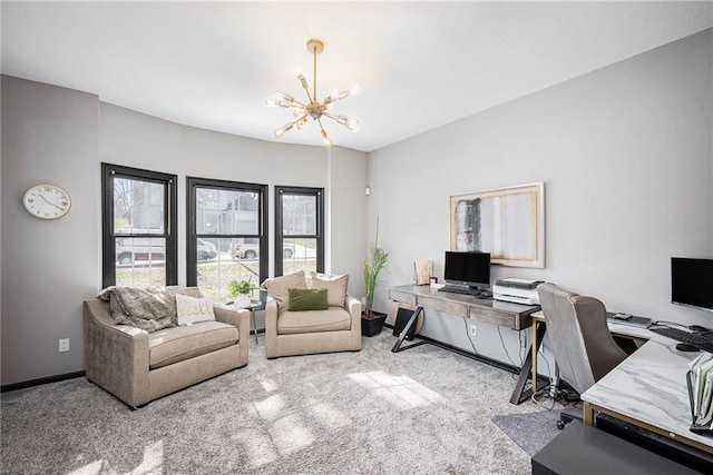 carpeted home office featuring baseboards and a notable chandelier