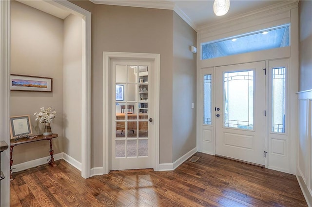 entrance foyer with ornamental molding, dark wood-type flooring, and baseboards