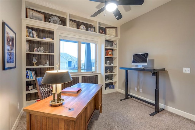 office area featuring ceiling fan, carpet flooring, built in features, and baseboards