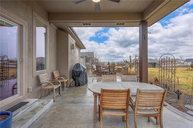 view of patio / terrace with visible vents, outdoor dining area, a grill, and a ceiling fan