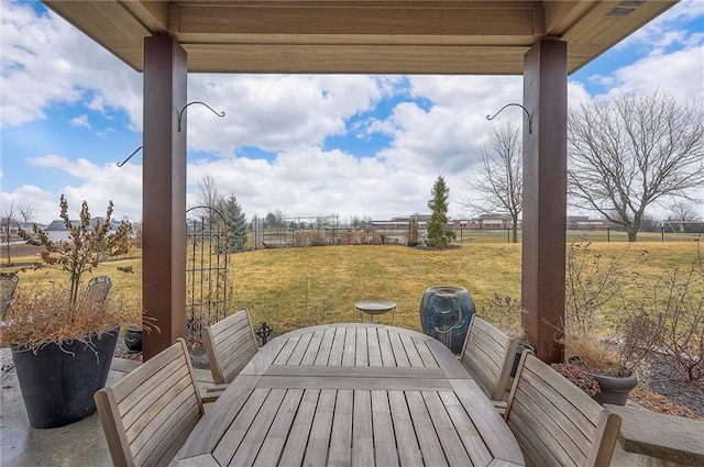 view of patio with a fenced backyard and outdoor dining area