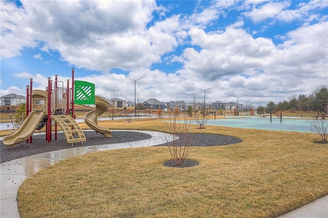 community jungle gym with a lawn