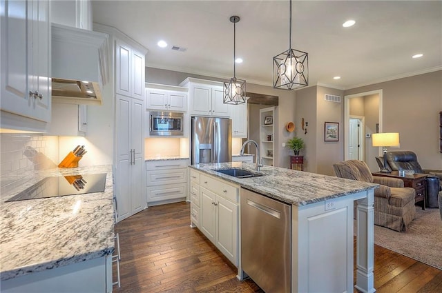 kitchen featuring white cabinets, visible vents, stainless steel appliances, and a sink