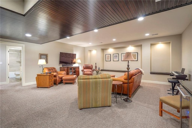 living area with visible vents, baseboards, wooden ceiling, carpet flooring, and recessed lighting