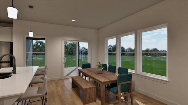 10605 N Jefferson St, Kansas City, MO 64155 - dining room featuring recessed lighting, light wood-style flooring, and baseboards