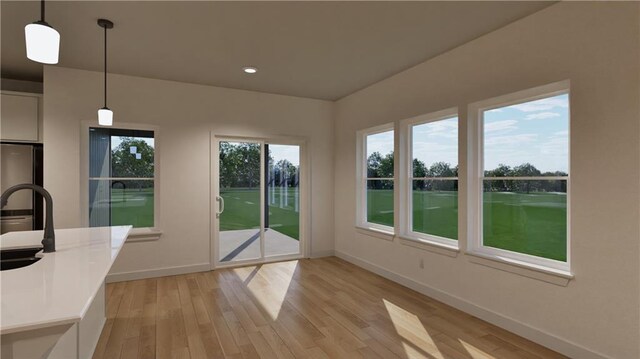 10605 N Jefferson St, Kansas City, MO 64155 - doorway to outside featuring recessed lighting, light wood-type flooring, and baseboards