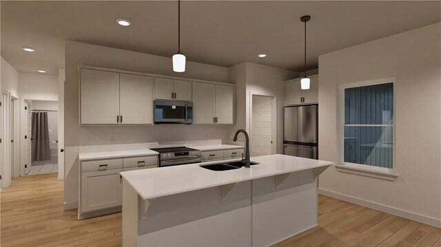 10605 N Jefferson St, Kansas City, MO 64155 - kitchen with pendant lighting, light countertops, light wood-style flooring, appliances with stainless steel finishes, and a sink
