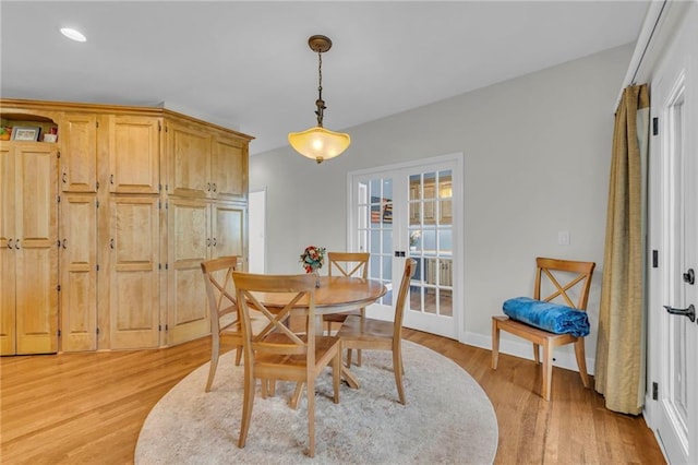 dining room with light wood-style floors, recessed lighting, baseboards, and french doors