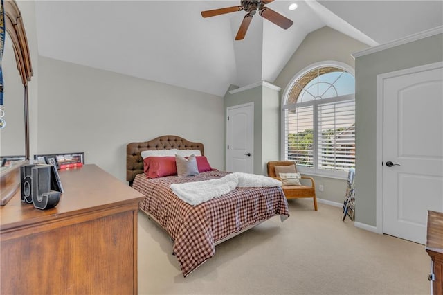 bedroom featuring lofted ceiling, light carpet, ceiling fan, and baseboards