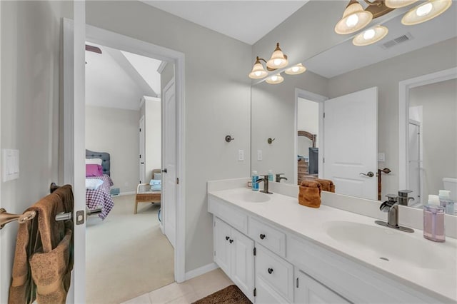 full bath featuring visible vents, a sink, ensuite bath, and double vanity