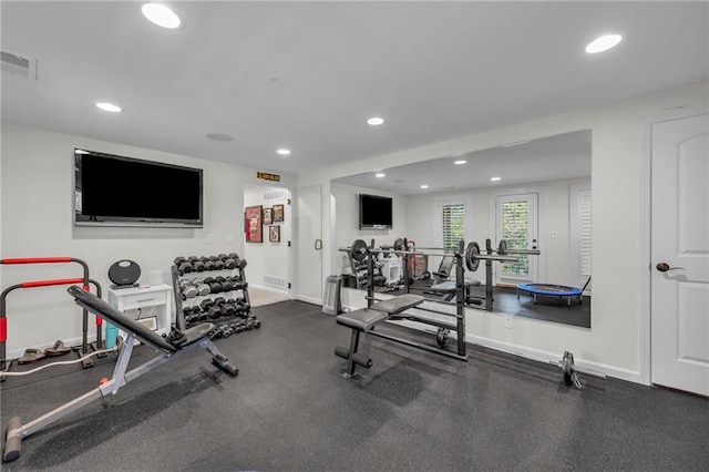 exercise area with recessed lighting, visible vents, and baseboards