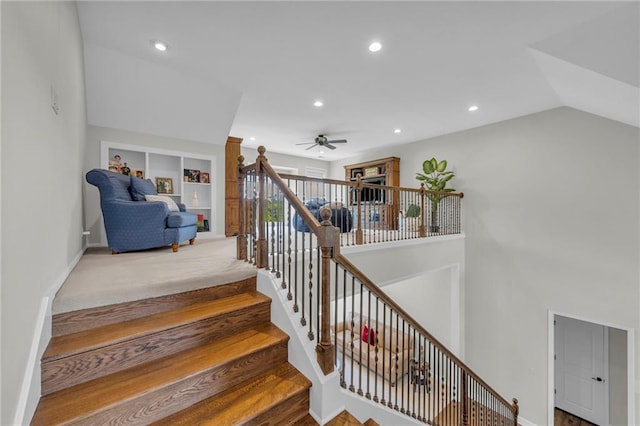 stairway featuring baseboards, built in features, ceiling fan, vaulted ceiling, and recessed lighting