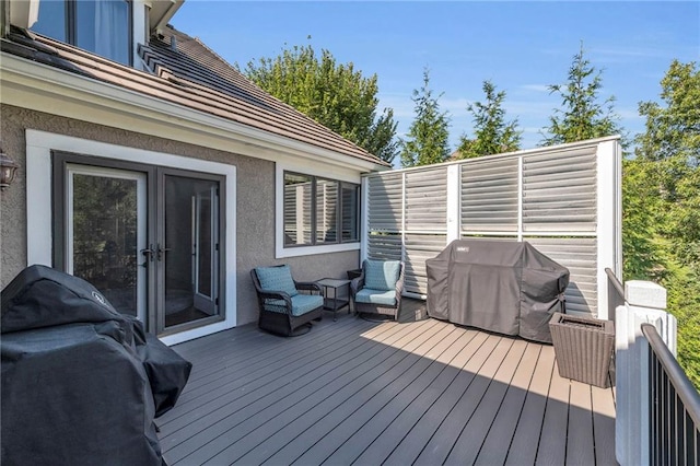 wooden deck with grilling area