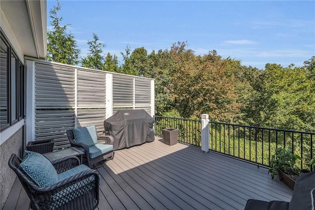 wooden deck featuring area for grilling