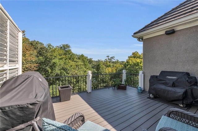 wooden deck with grilling area