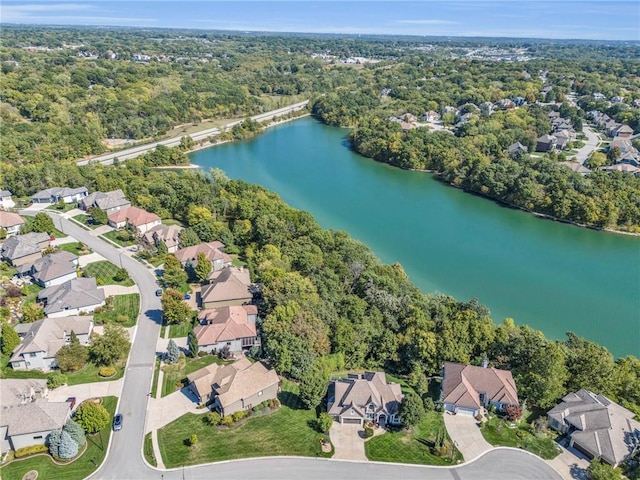 birds eye view of property with a water view, a forest view, and a residential view