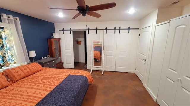1147 Fern Rd, Fort Scott, KS 66701 - bedroom with recessed lighting, ceiling fan, two closets, and a barn door