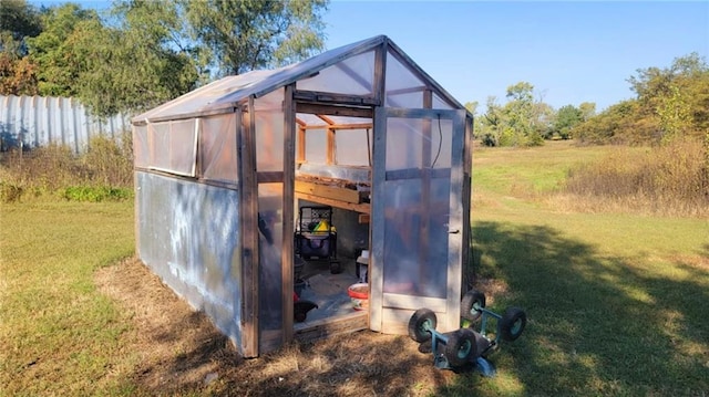 1147 Fern Rd, Fort Scott, KS 66701 - view of greenhouse with a yard