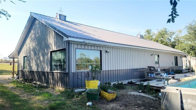 1147 Fern Rd, Fort Scott, KS 66701 - view of side of home with metal roof and board and batten siding