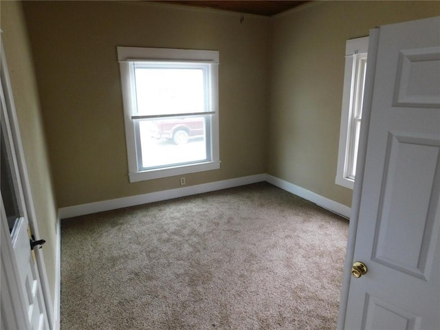 306 W Kansas St, Pittsburg, KS 66762 - carpeted empty room featuring baseboards