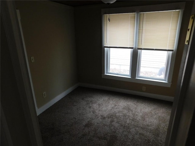 306 W Kansas St, Pittsburg, KS 66762 - carpeted spare room featuring baseboards