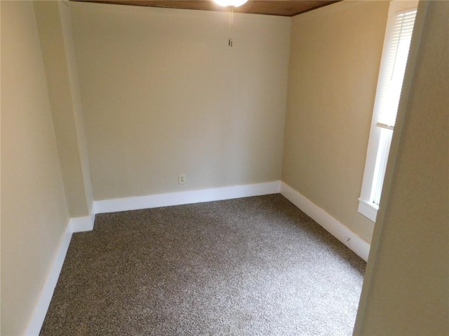 306 W Kansas St, Pittsburg, KS 66762 - carpeted spare room featuring baseboards