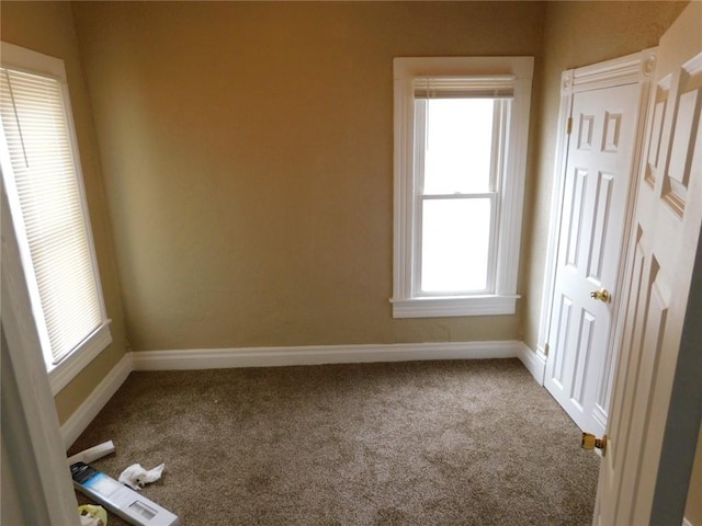 306 W Kansas St, Pittsburg, KS 66762 - spare room featuring carpet flooring and baseboards