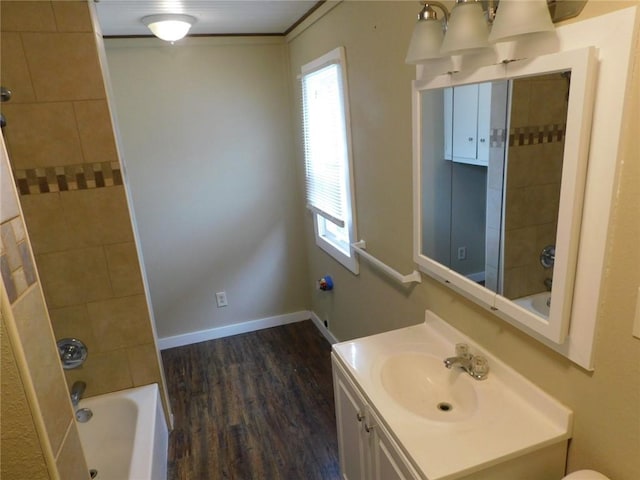 306 W Kansas St, Pittsburg, KS 66762 - full bathroom with shower / tub combination, vanity, baseboards, and wood finished floors
