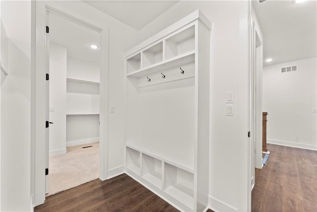 mudroom featuring baseboards, visible vents, dark wood finished floors, and recessed lighting