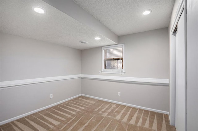 interior space with carpet floors, recessed lighting, and baseboards