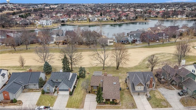 drone / aerial view featuring a water view and a residential view