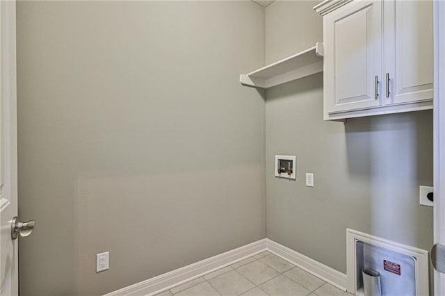 washroom with light tile patterned floors, hookup for a washing machine, cabinet space, electric dryer hookup, and baseboards