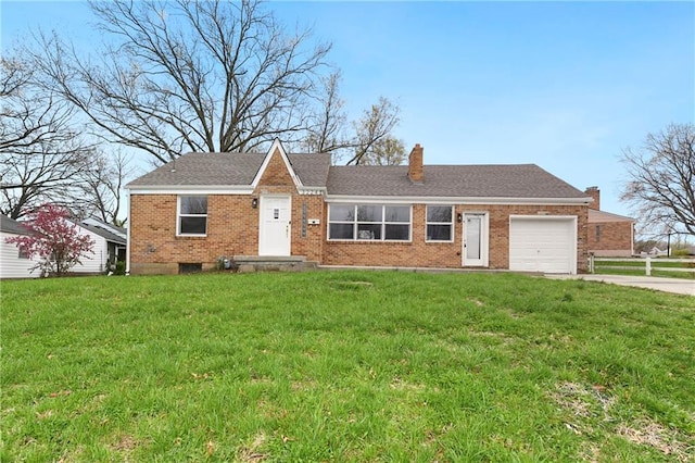 3224 E Barker Cir, Kansas City, KS 66104 - ranch-style home featuring a chimney, a garage, concrete driveway, brick siding, and a front yard