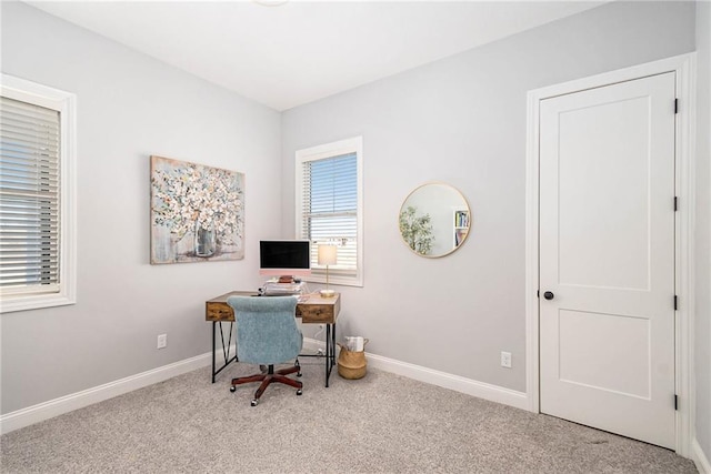 home office featuring baseboards and carpet floors