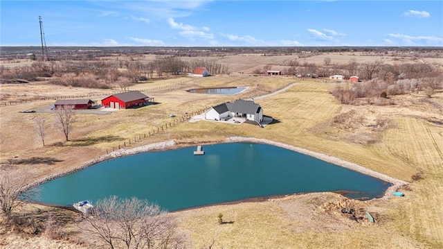 bird's eye view with a rural view and a water view