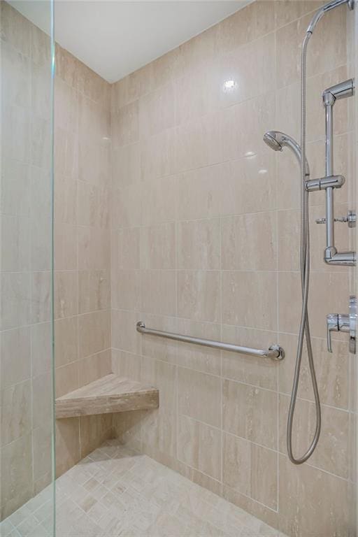 bathroom with a tile shower