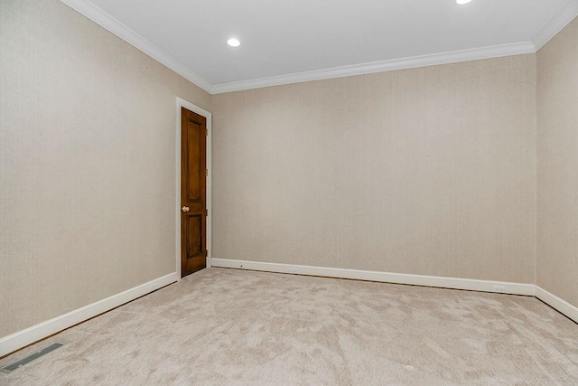 carpeted empty room with recessed lighting, visible vents, baseboards, and crown molding