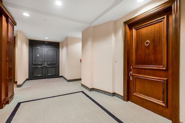 corridor featuring recessed lighting, baseboards, and carpet floors