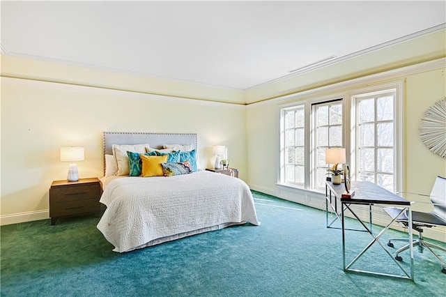 carpeted bedroom with ornamental molding and baseboards