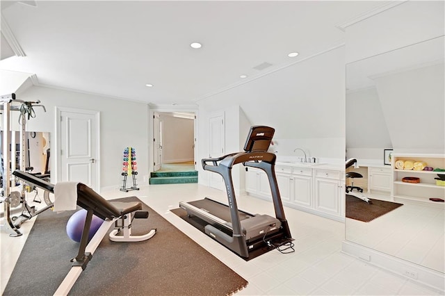 exercise room featuring ornamental molding, a sink, and recessed lighting