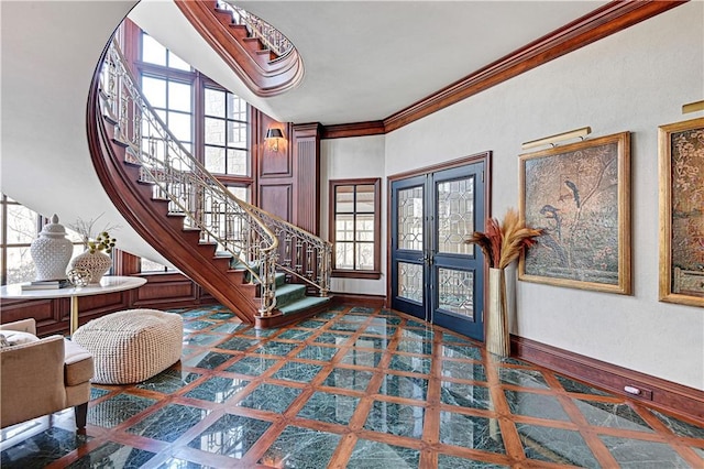 entrance foyer featuring stairs, french doors, baseboards, and crown molding