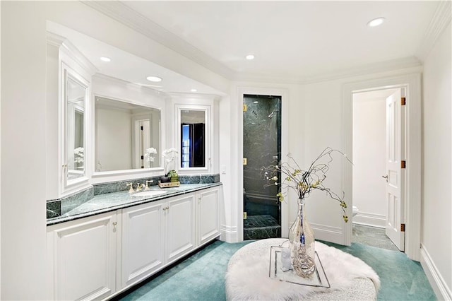 full bath featuring baseboards, ornamental molding, vanity, and recessed lighting