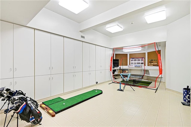 exercise area featuring visible vents and tile patterned floors