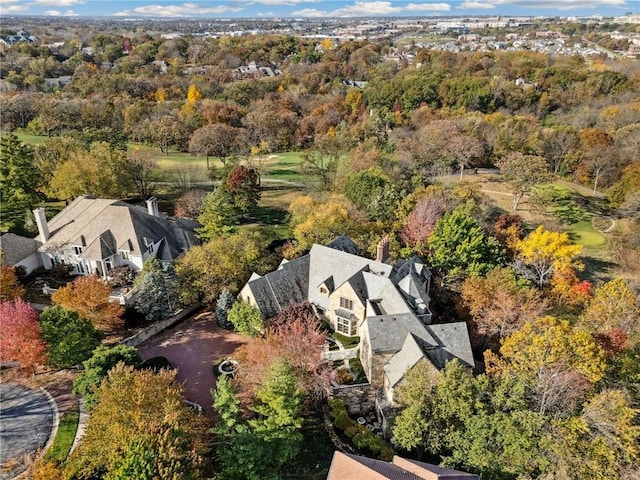 drone / aerial view featuring a forest view