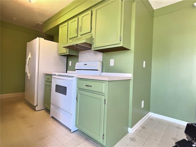 kitchen featuring under cabinet range hood, white appliances, light countertops, and green cabinetry