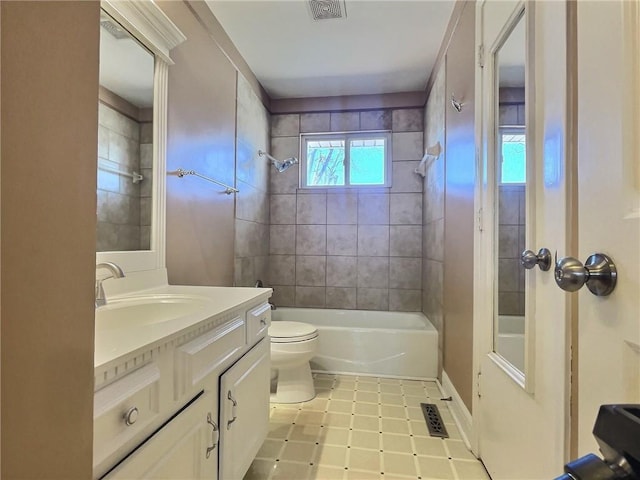 bathroom featuring visible vents, toilet, tub / shower combination, and vanity