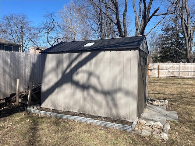 view of shed featuring a fenced backyard