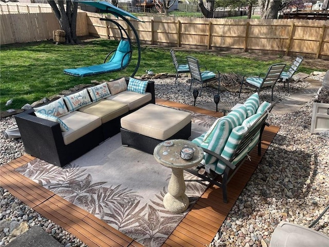 view of patio with outdoor lounge area and a fenced backyard