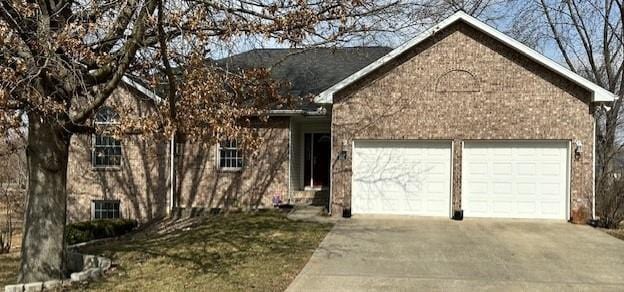 view of front of house with an attached garage and concrete driveway